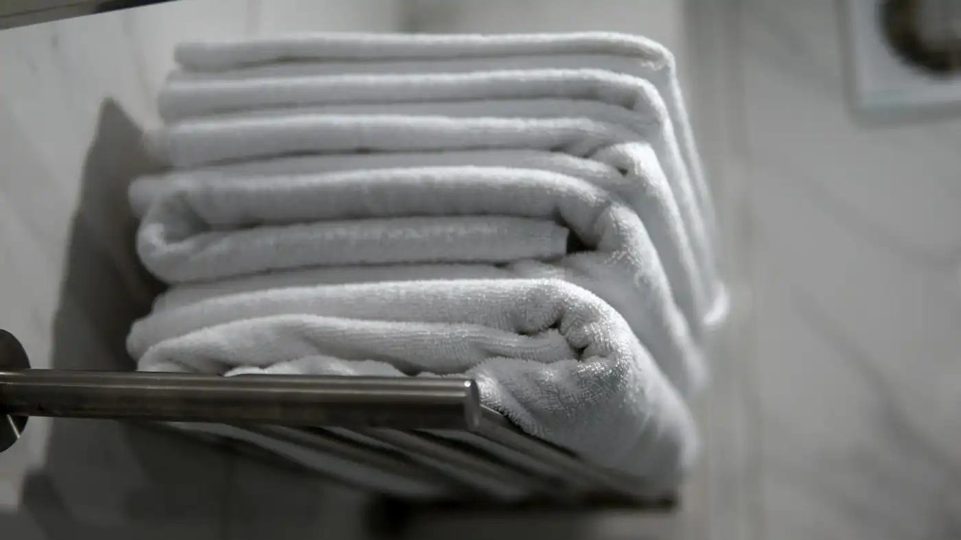 Folded towels on a towel rail