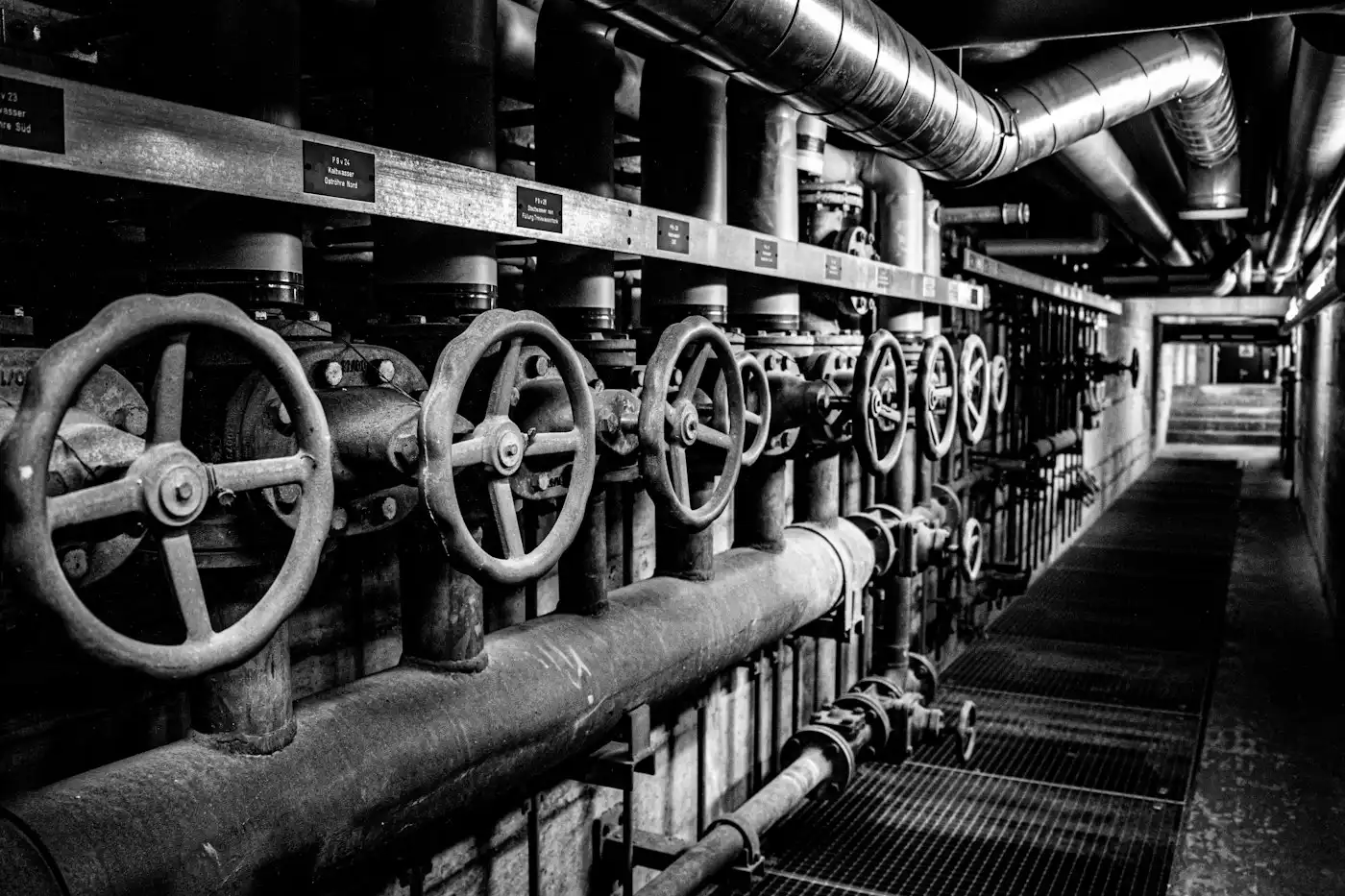 Industrial valves and pipes in a corridor