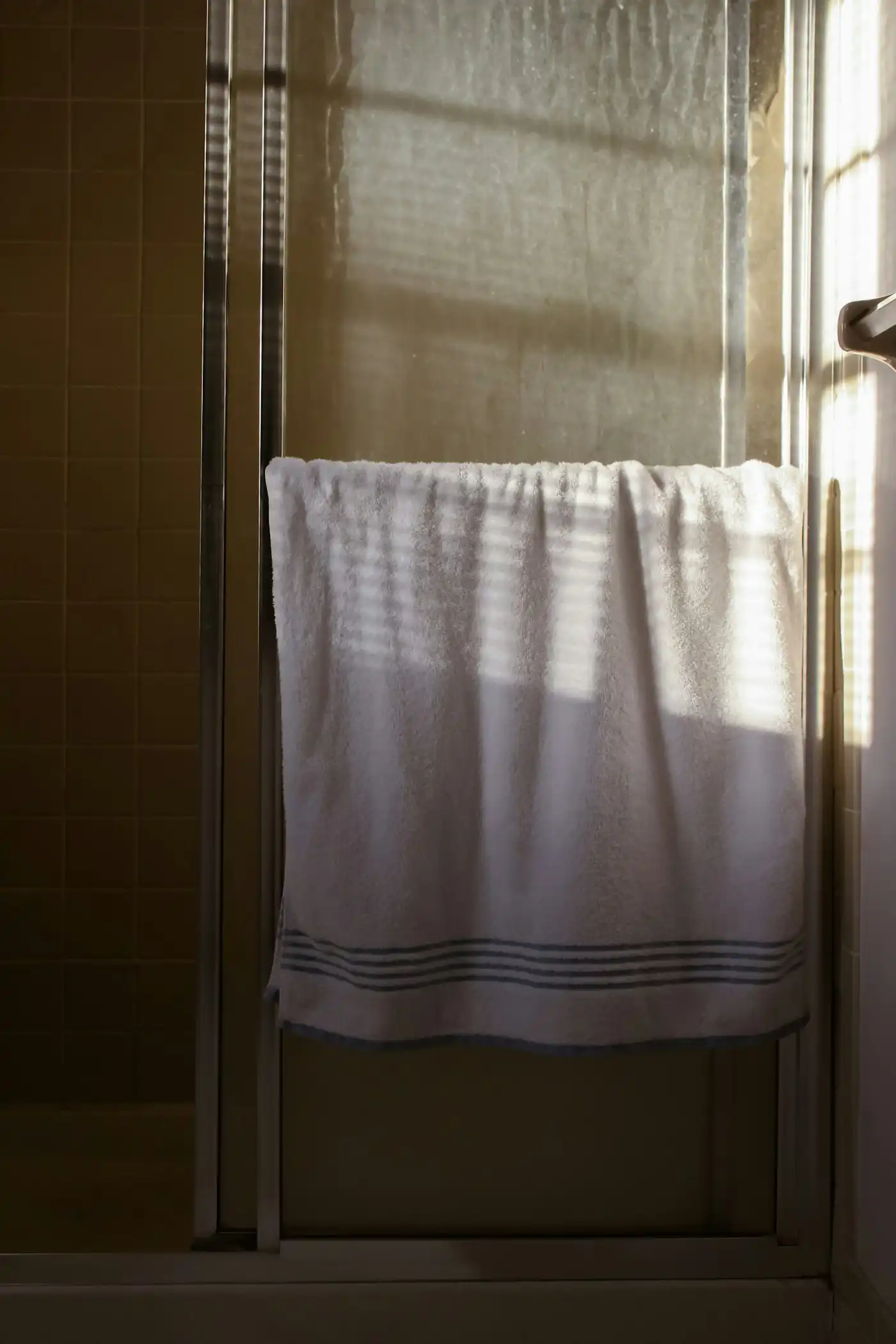 White towel on a steel towel rail
