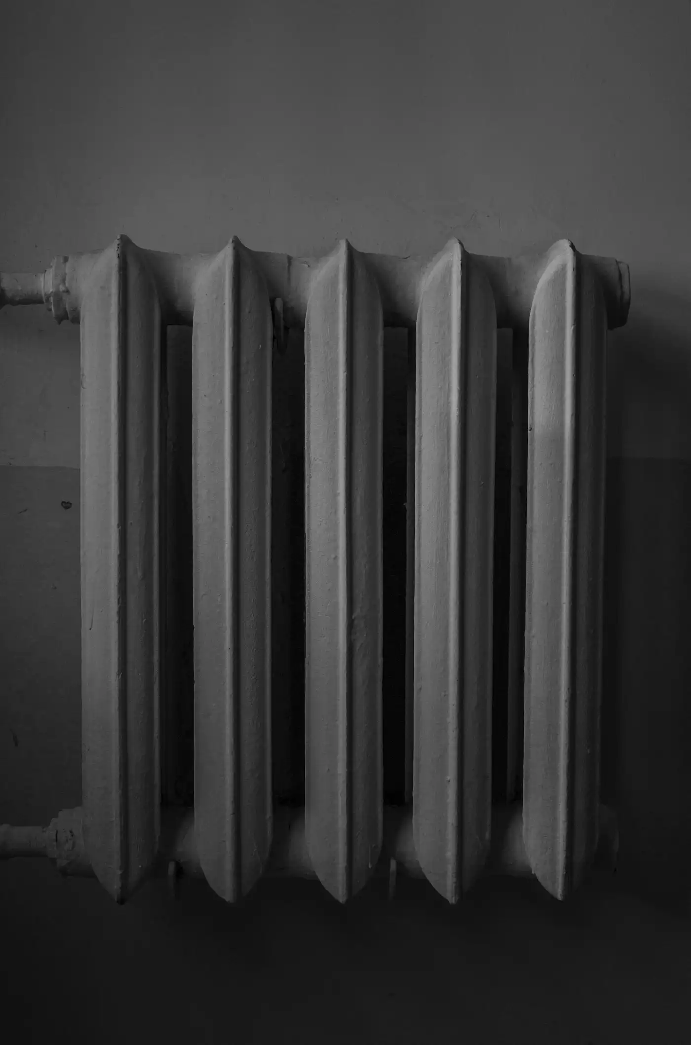 Column radiator on a white wall