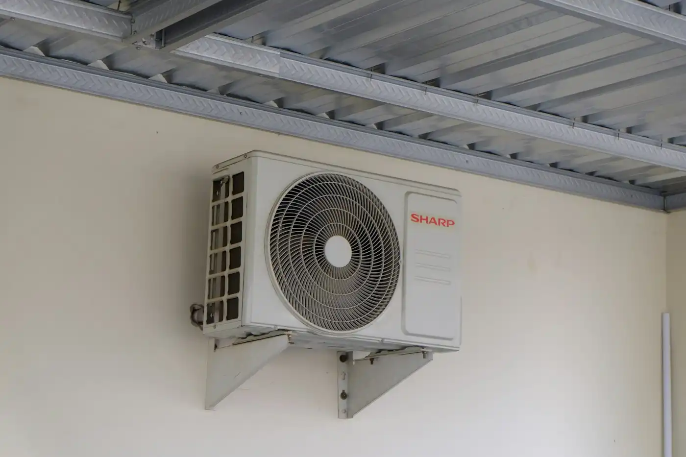 Outdoor unit mounted on a wall