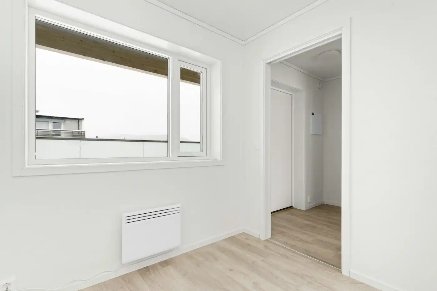 Minimal room with a window and radiator