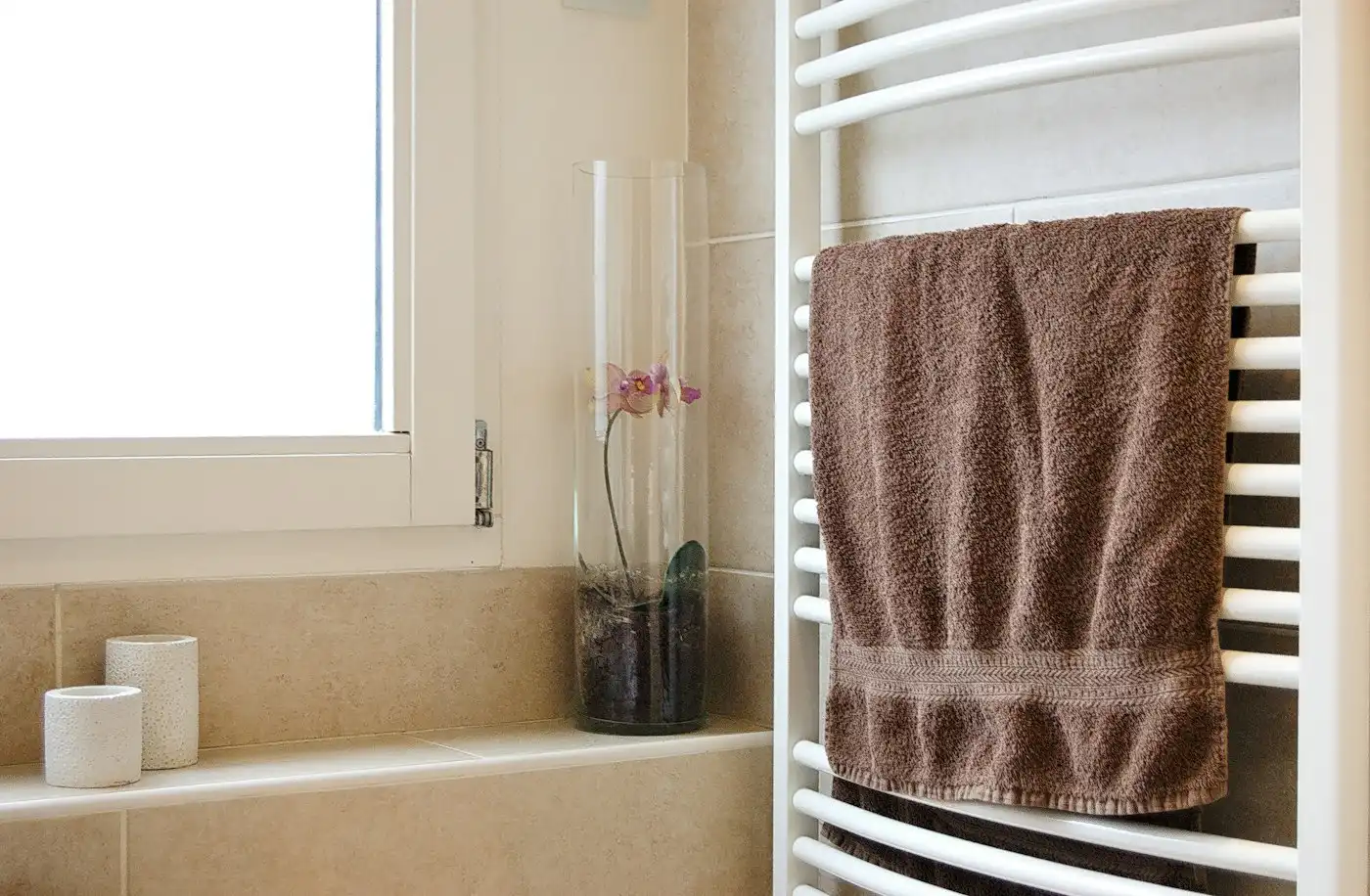Towel on a white metal towel rail