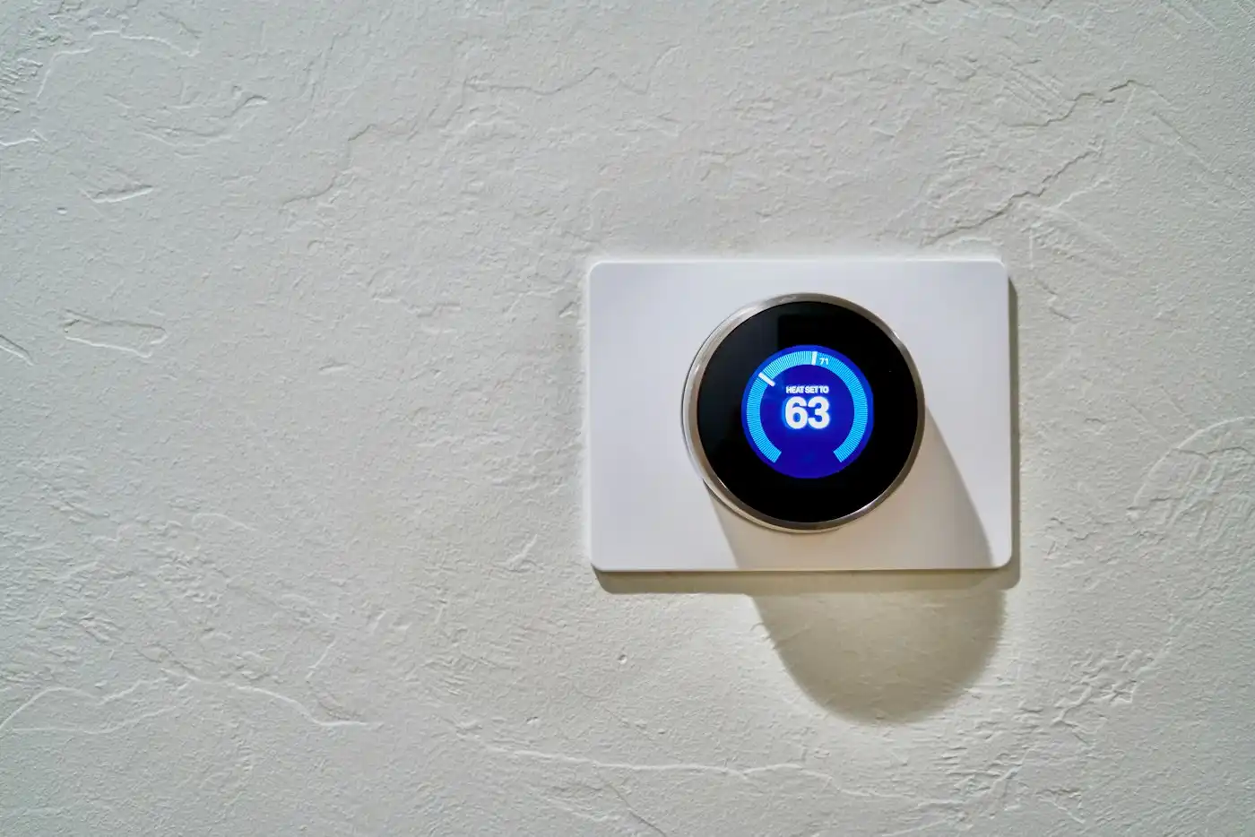 Smart thermostat on a wall