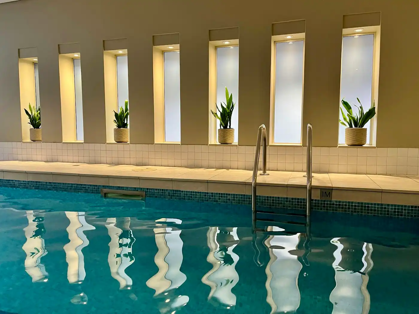 Indoor pool with a row of windows