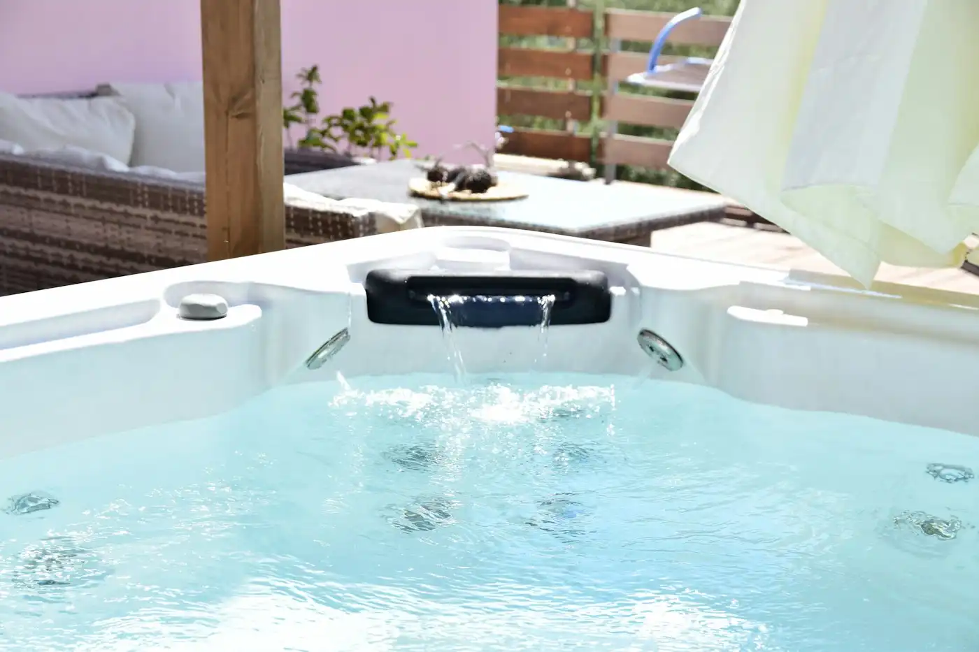 Spa pool with a chair and a table