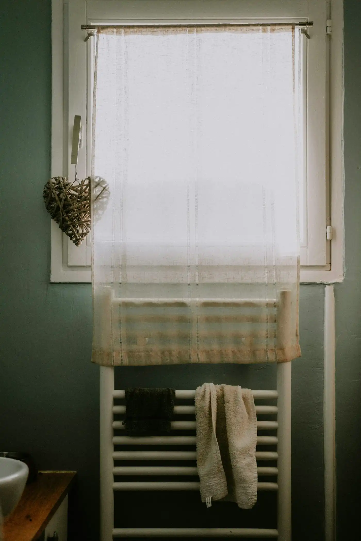 Bathroom with a window and radiator