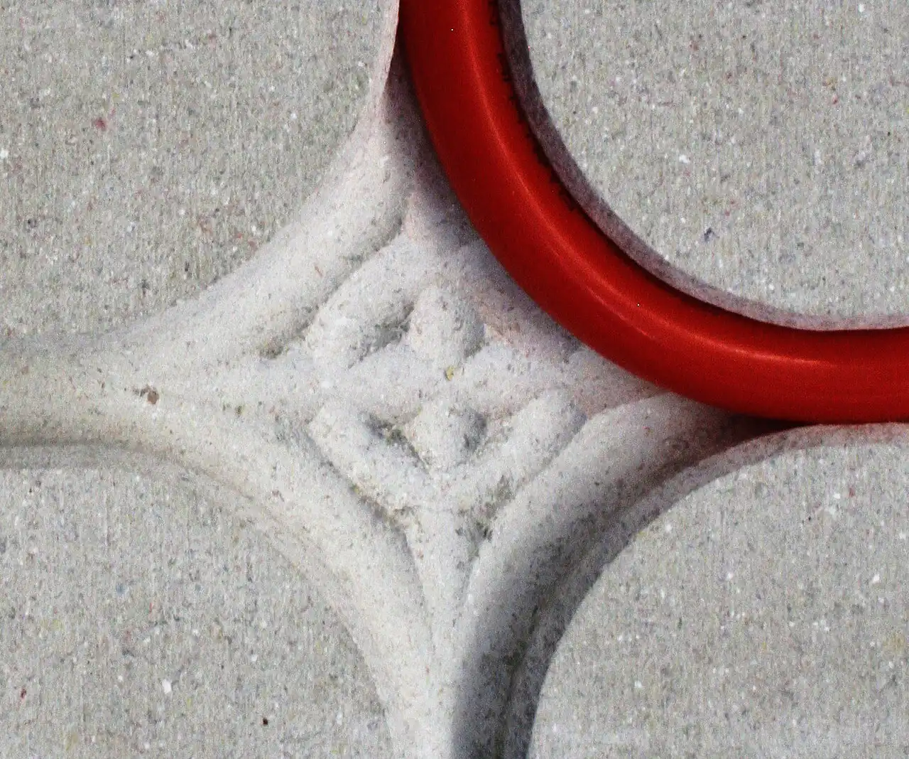 Underfloor heating pipe in a routed base board