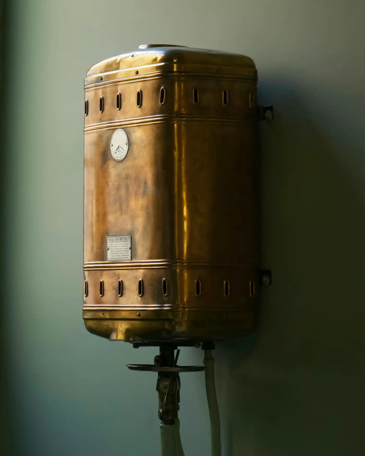 Wall-mounted boiler on a white wall