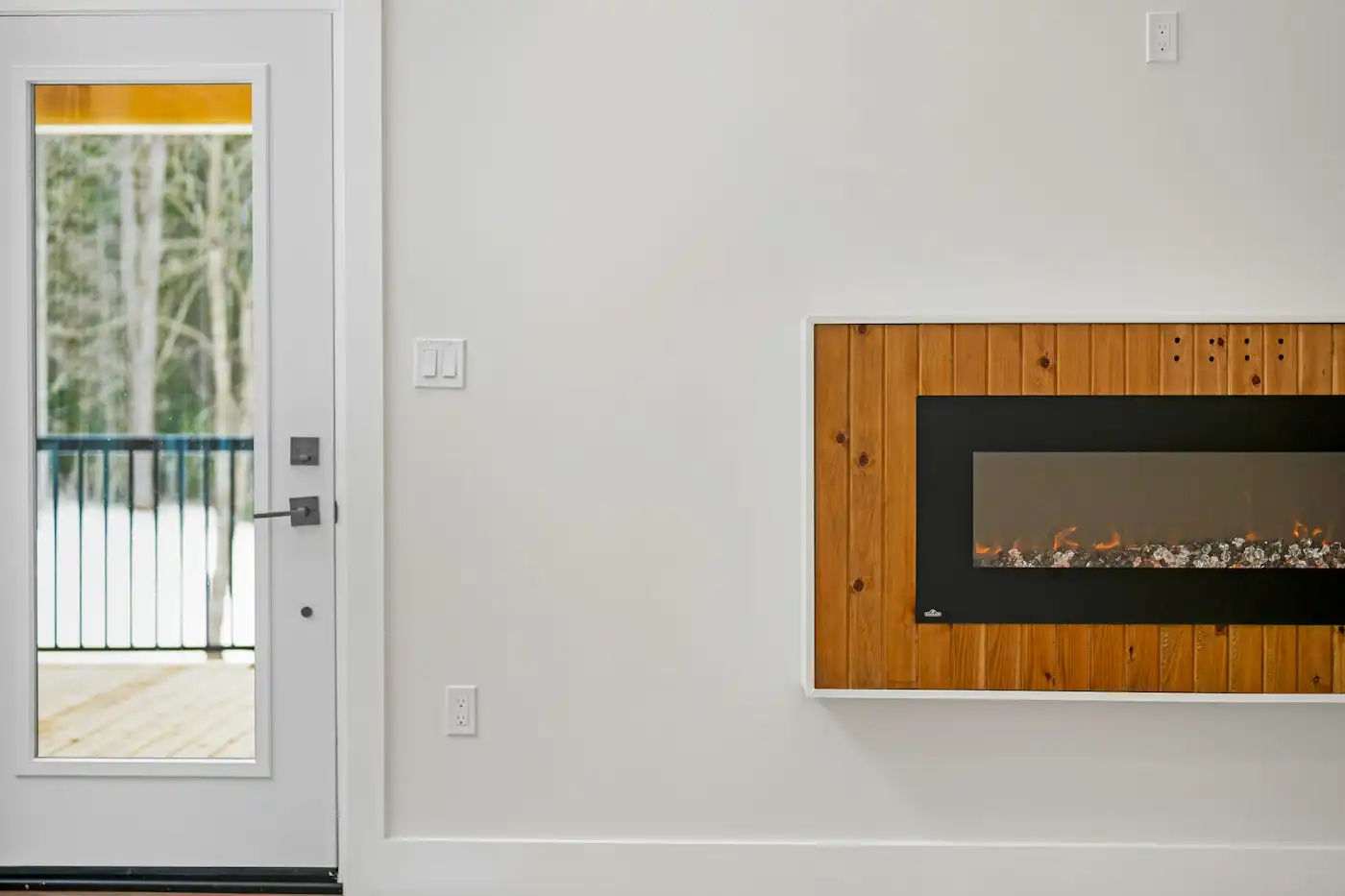 Modern electric fireplace with wood trim